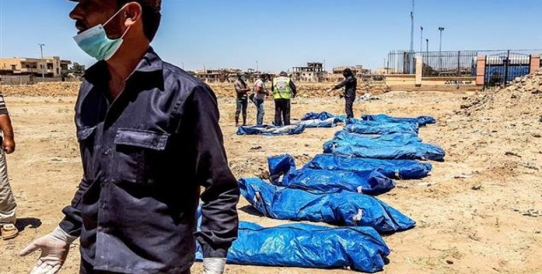 The remains of bodies recovered from a mass grave in the northern Syrian city of Raqqah on July 22, 2018.  Photo: via Facebook