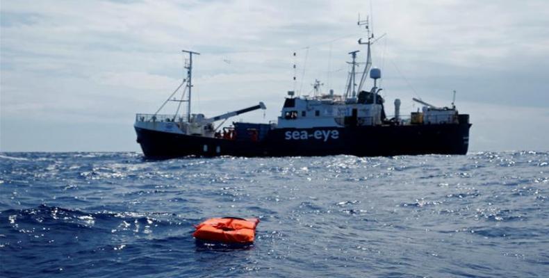 Migrants on board German rescue vessel will be transferred to another ship for screening and quarantine.