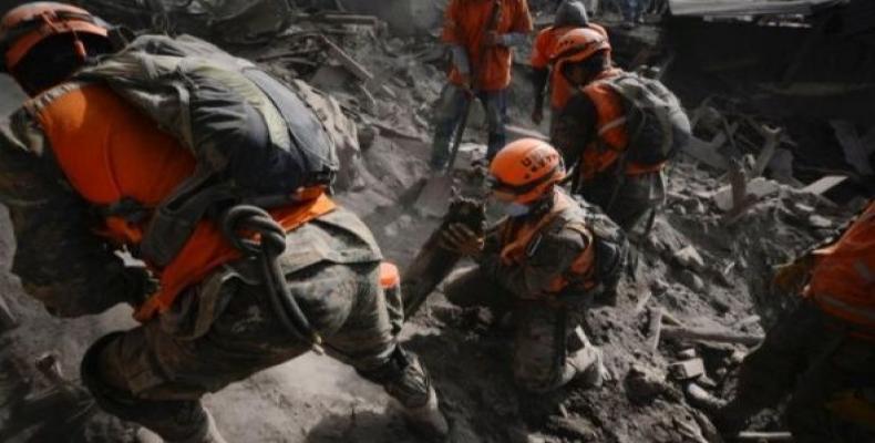 Soldiers search for remains at an area affected by the eruption of El Fuego volcano in Guatemala.  Photo: Reuters