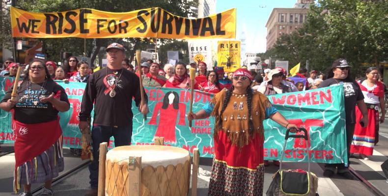 Activists around the world rally to demand action on climate change.  Photo: Democracy Now