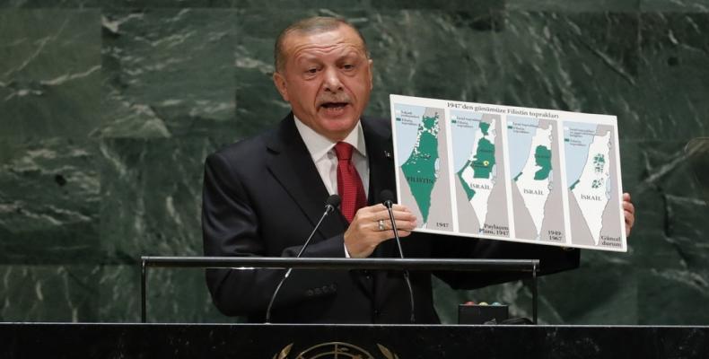 Turkey's President Recep Tayyip Erdogan holds up a map.  (Photo: AFP)
