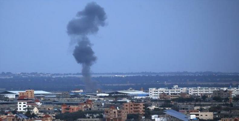 Smoke rises above buildings in Rafah, the southern Gaza Strip, during Israeli strikes. Press TV Photo