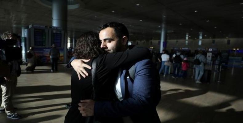 Omar Shakir hugs a friend at the terminal before departing Israel at Ben Gurion International Airport.  (Photo: Reuters)