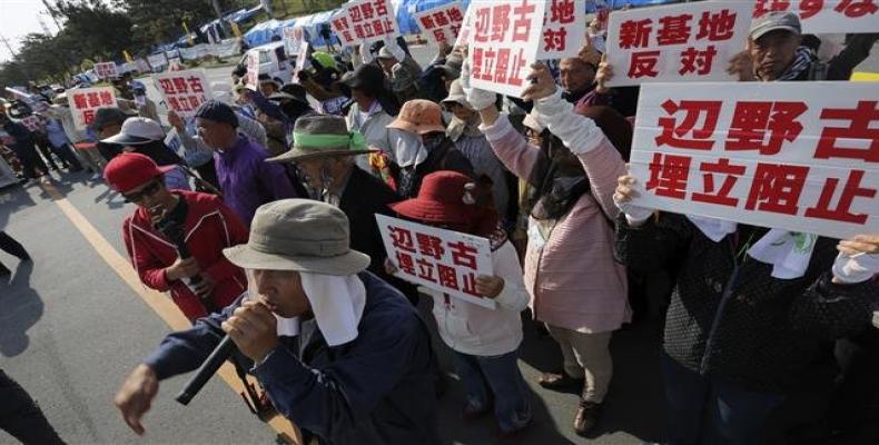 Campaigners protest against a plan for relocation of US airbase in Okinawa in Nago, Okinawa Prefecture on March 23, 2015.  Photo: AP