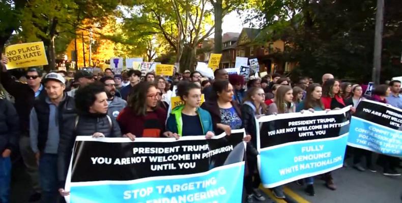 Thousands march in Pittsburgh as Donald Trump visits site of anti-Semitic mass shooting.  Photo: AP