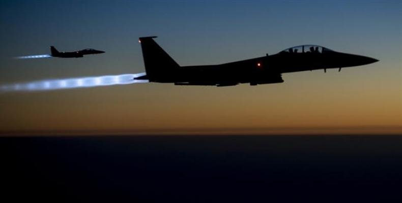 The file photo taken by the US Air Forces Central Command shows a pair of US Air Force F-15E warplanes flying over northern Iraq after conducting airstrikes in