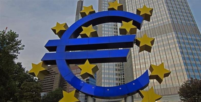 This file photo taken on February 7, 2018 shows the Euro logo is pictured in front of the former headquarters of the European Central Bank (ECB) in Frankfurt, w