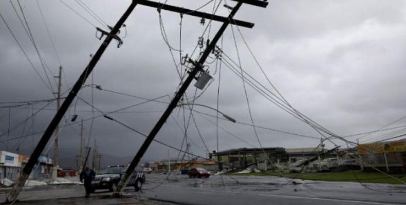 Since last September, dozens of the cities in Puerto Rico remain dark and abandoned without running water or electricity.  Photo: Reuters