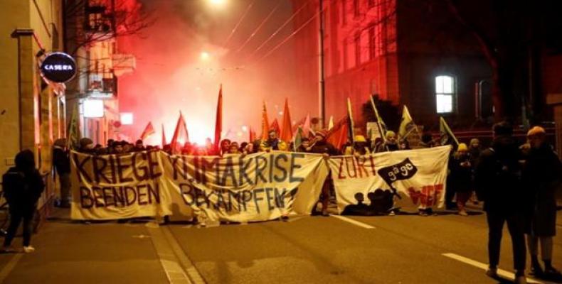 Protest against the 50th World Economic Forum (WEF) annual meeting in Davos. The banner reads &quot;End Wars! Fight the Climate Crisis!&quot; (Photo by Reuters