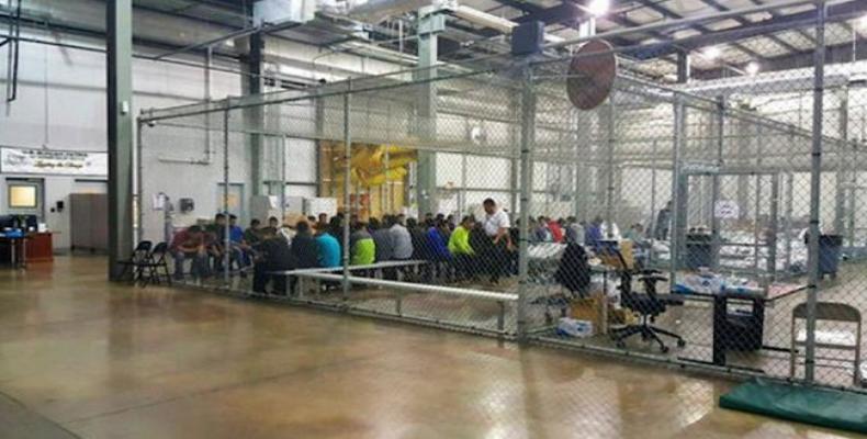 This file photo shows migrant families being held in large cages.  Photo: File