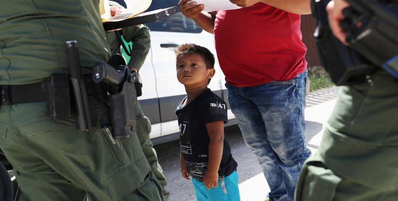 Migrant families about to be processed in Texas.  Photograph: Larry W. Smith/EPA