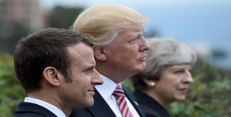 Donald Trump together with May and Macron.  Photo: Reuters