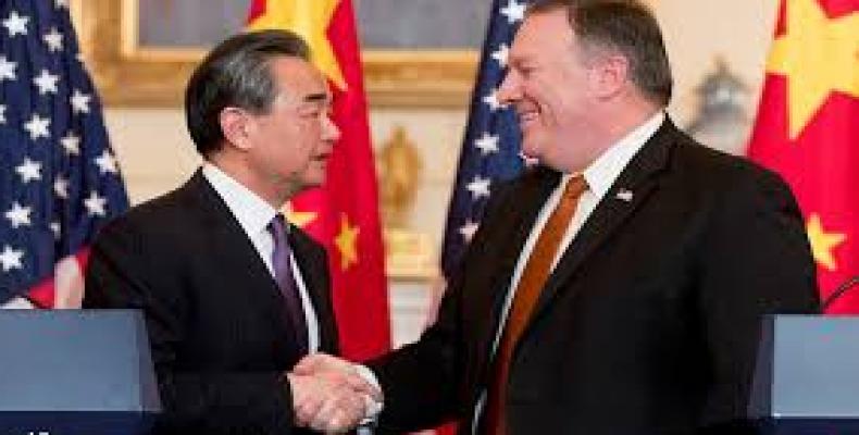 Chinese Foreign Minister Wang Yi shakes hands with US Secretary of State Mike Pompeo before their meeting at the Diaoyutai State Guesthouse in Beijing.  Photo: