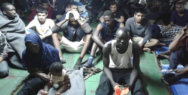 Asylum-seekers refuse to leave docked Libyan ship, citing torture.  Photo: Democracy Now