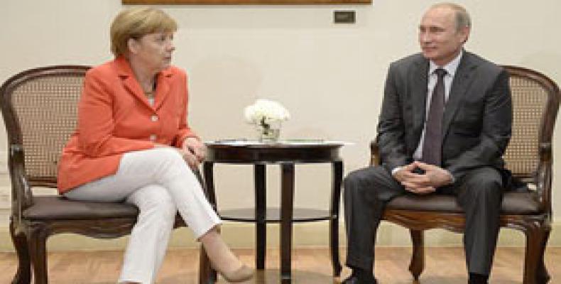 Putin y Merkel en anterior encuentro. Foto:  Archivo