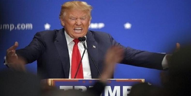 U.S. President Donald Trump reacts during a speech.  Photo: Reuters