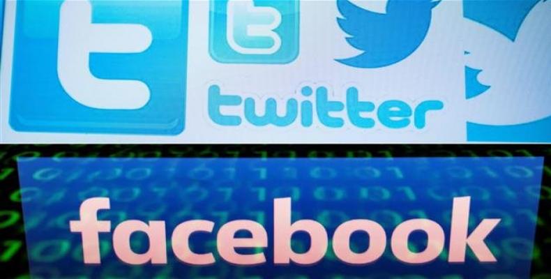 This combination of file pictures shows a photo illustration of Twitter logos and a file illustration picture taken of the logo of social network Facebook.  Pho