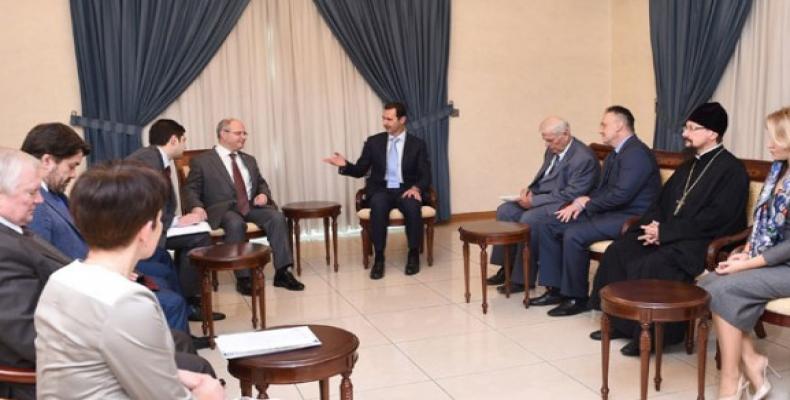 Al Assad y la delegación rusa