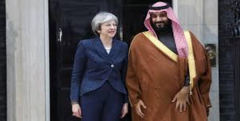 File photo shows British Prime Minister Theresa May greeting the Crown Prince of Saudi Arabia Mohammad bin Salman outside 10 Downing Street on March 7, 2018.
