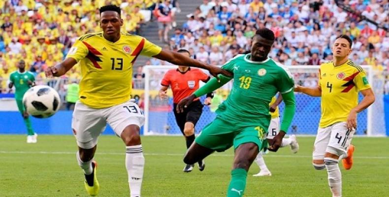 Sur la photo, Yerry Mina (T-shirt jaune) le meneur de jeu de la Colombie