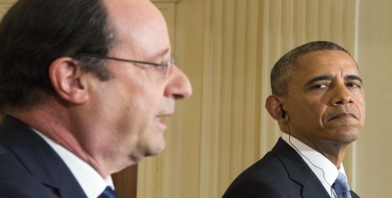 François Hollande et Barack Obama à la Maison Blanche, en février 2014. Crédits photo : JIM WATSON/AFP