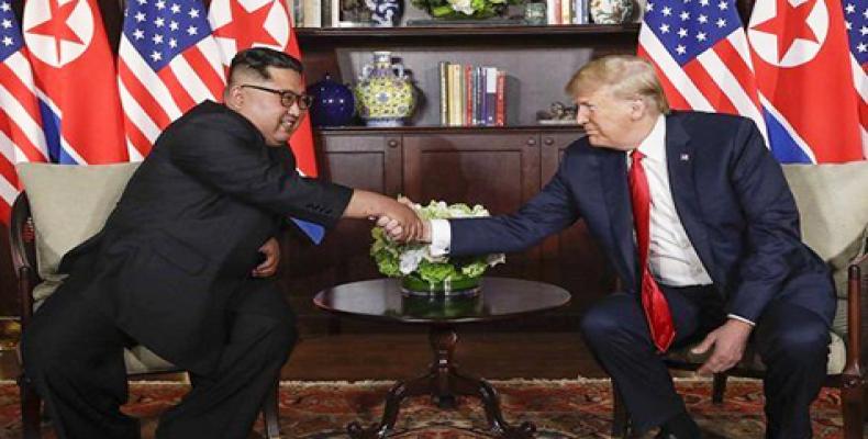 Kim Jong-un and Donald Trump shake hand  at the beginning of the summit. AP Photo