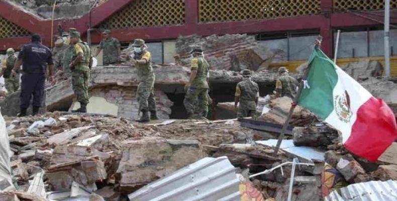 Soldiers remove debris from a partly collapsed municipal building, which was felled by a massive earthquake, in Juchitan, Oaxaca state, Mexico. Photo: Reuters