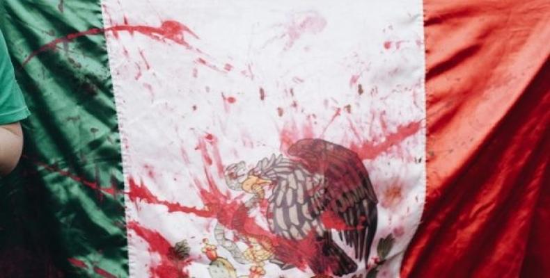 Bloodied Mexican flag symbolizes violent elections.  Photo: Reuters