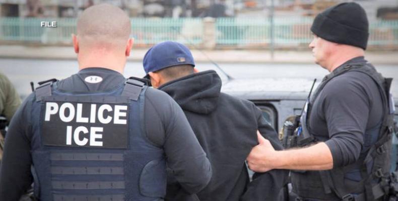 ICE agents arrest undocumented immigrants.  Photo: AP File photo