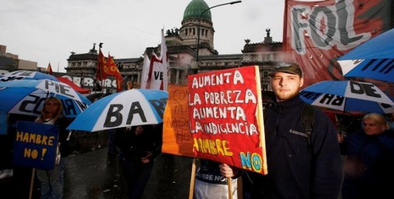 Demonstrators protest the budget bill outside the Congress in Buenos Aires, Argentina, October 24, 2018. The sign reads: &quot;Poverty increases, indigence incr