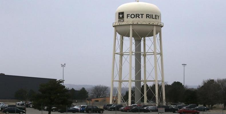 Vehicles park around a water tower at Fort Riley, Kansas. (File: Orlin Wagner/AP Photo)