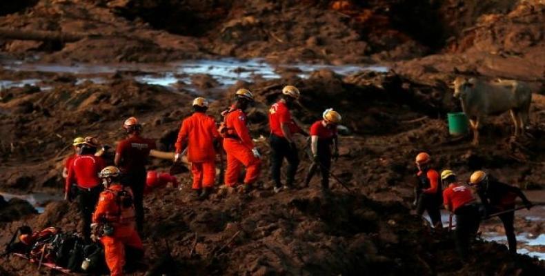 Mining dam collapse kills at least 65 in Brazil.  Photo: AP