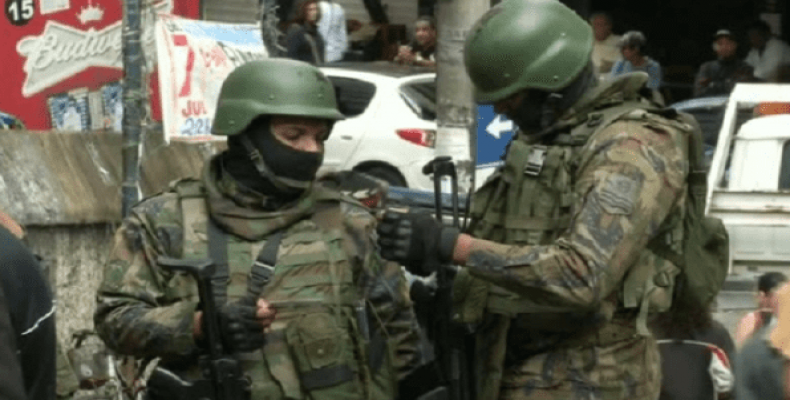 Troops patrolling the favelas in Rio de Janeiro.   Photo: Reuters