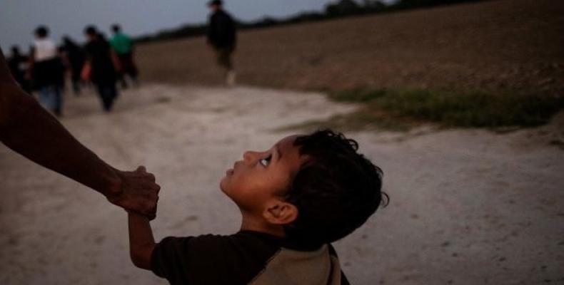 Asylum seeker and 4-year-old child reunited after separation of 8 months.  Photo: Press TV