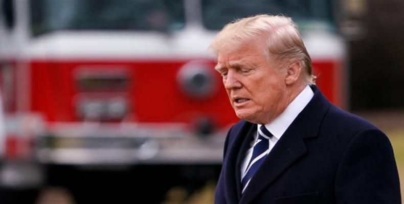 US President Donald Trump makes his way to board Marine One before departing from the South Lawn of the White House on February 1, 2018 in Washington, DC. (Phot