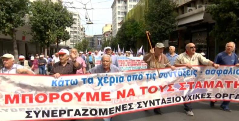 Greek pensioners take to the streets with walking sticks over pension cuts.  Photo: Reuters