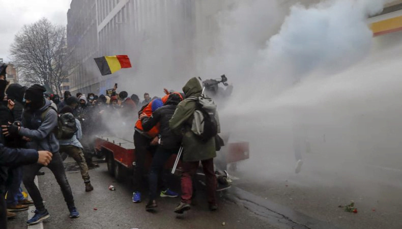 Police in Brussels clash with protesters against COVID restrictions