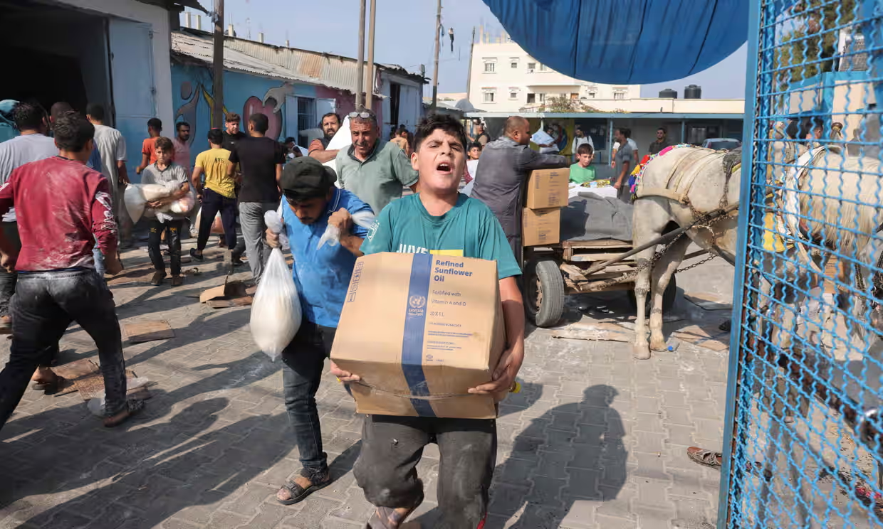 Palestinians break into Gaza UN aid warehouses as toll tops 8,000