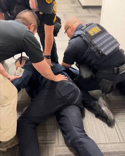 U.S. federal agents handcuff and forcibly remove Californica senator at Homeland Secretary secretary's news conference